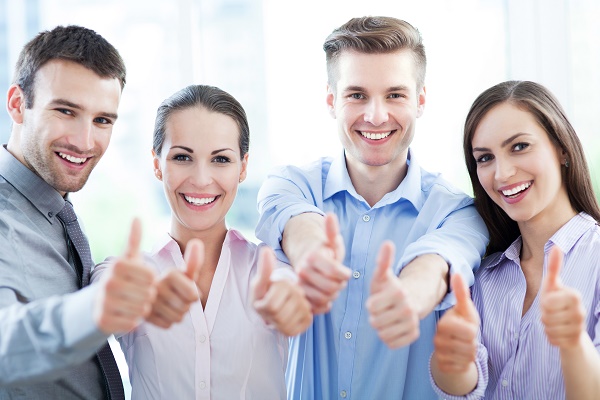 Business team with thumbs up